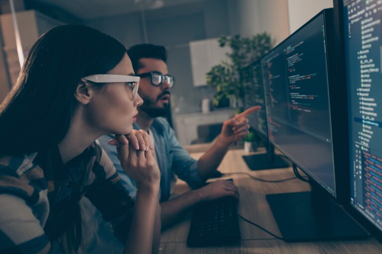 profile photo of it specialist guy lady two business people night coworking watch together indicate monitor testing debugging java script code smart professionals office indoors